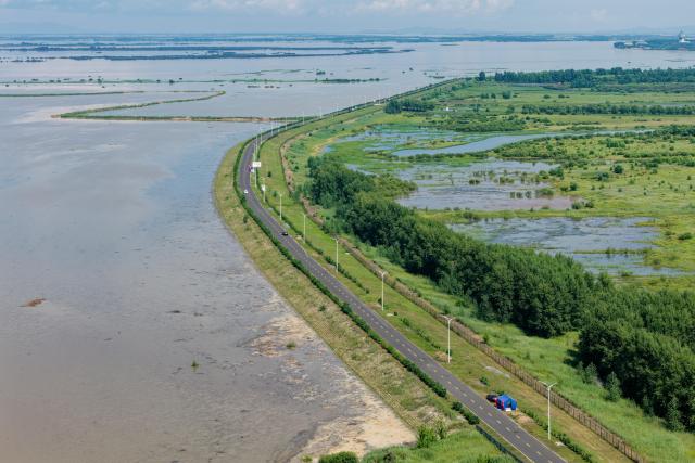 (260806) -- HARBIN, Aug. 6, 2026 (Xinhua) -- An aerial drone photo taken on Aug. 6, 2026 shows a temporary flood prevention spot in Tongjiang City, northeast China's Heilongjiang Province. Flood prevention measures have been implemented across northeast China's Heilongjiang Province, which has entered its main flood season.
  China has earmarked 50 million yuan (about 7.36 million U.S. dollars) in central government funds to support post-disaster recovery in flood-hit Heilongjiang Province in the northeast, the National Development and Reform Commission (NDRC) said Tuesday. (Xinhua/Zhang Tao)