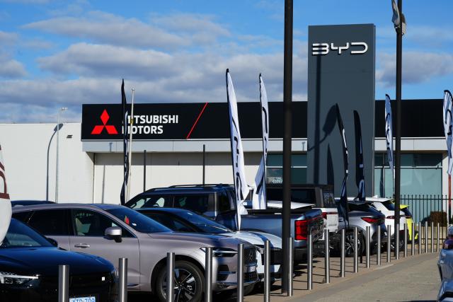 (260806) -- CANBERRA, Aug. 6, 2026 (Xinhua) -- Chinese auto manufacturer BYD's logo (R) is seen in Canberra, Australia, Aug. 6, 2026. New electric vehicles (EVs) accounted for over 20 percent of car sales in Australia for the third consecutive month in July, according to new industry data.
TO GO WITH "EV sales in Australia remain strong in July: industry data" (Photo by Zhang Na/Xinhua)