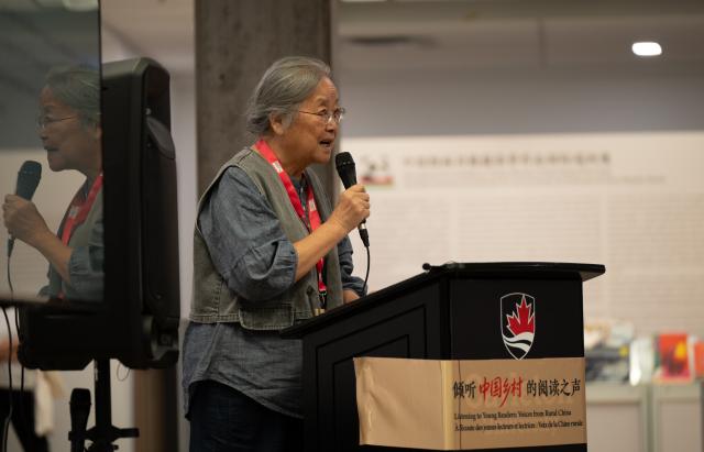 (260806) -- OTTAWA, Aug. 6, 2026 (Xinhua) -- Chinese illustrator Cai Gao, winner of the 2026 Hans Christian Andersen Award, speaks at the opening ceremony of an exhibition titled "Listening to Young Readers: Voices from Rural China" in Ottawa, Canada, Aug. 5, 2026. TO GO WITH "China's rural reading efforts showcased at exhibition in Canada" (Photo by Li Haitao/Xinhua)