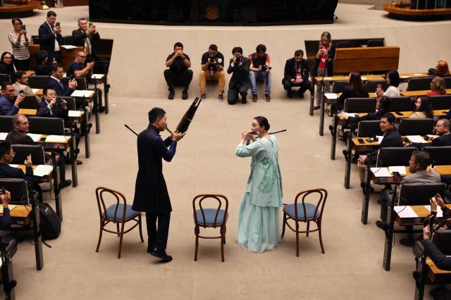 (260806) -- BRASILIA, Aug. 6, 2026 (Xinhua) -- Musicians from the Shanghai Chinese Orchestra perform at the Brazilian National Congress in Brasilia, Brazil, Aug. 3, 2026. A special meeting to celebrate the China-Brazil Cultural Year, the National Chinese Immigration Day and the 52nd anniversary of China-Brazil diplomatic relations was held at the Brazilian National Congress in Brasilia of Brazil on Monday. (Xinhua/Jin Haoyuan)