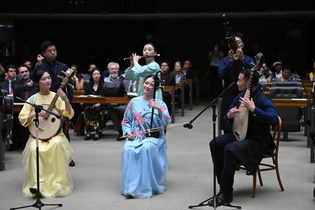 (260806) -- BRASILIA, Aug. 6, 2026 (Xinhua) -- Musicians from the Shanghai Chinese Orchestra perform at the Brazilian National Congress in Brasilia, Brazil, Aug. 3, 2026. A special meeting to celebrate the China-Brazil Cultural Year, the National Chinese Immigration Day and the 52nd anniversary of China-Brazil diplomatic relations was held at the Brazilian National Congress in Brasilia of Brazil on Monday. (Photo by Lucio Tavora/Xinhua)