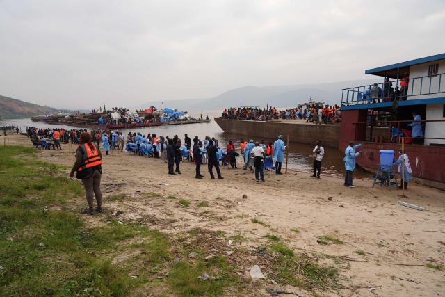 (260807) -- KINSHASA, Aug. 7, 2026 (Xinhua) -- Health officers conduct an investigation after the interception of a passenger boat outside Kinshasa, capital of the Democratic Republic of the Congo (DRC), Aug. 6, 2026. Health authorities in the DRC have intercepted a passenger boat outside Kinshasa following the death of a former passenger suspected of having Ebola, officials said Wednesday. (Xinhua)
