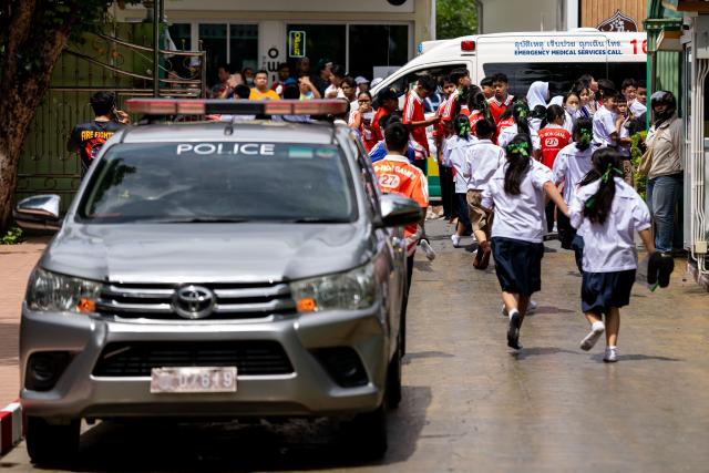 (260807) -- NONTHABURI, Aug. 7, 2026 (Xinhua) -- Emergency vehicles are parked at the site of a school shooting in Nonthaburi Province, Thailand, on Aug. 7, 2026. The death toll of a school shooting in Thailand's Nonthaburi Province on Friday morning has risen to seven, authorities said. (Xinhua)