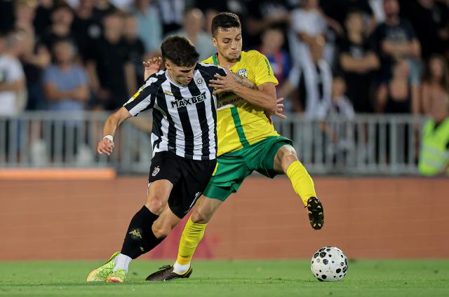(260807) -- BELGRADE, Aug. 7, 2026 (Xinhua) -- Partizan's Milan Vukotic (L) vies with Tobol's Amine Talal during the third qualifying round 1st leg football match between Partizan and Tobol at the UEFA Conference League 2026/27 in Belgrade, Serbia on Aug. 6, 2026. (Photo by Predrag Milosavljevic/Xinhua)