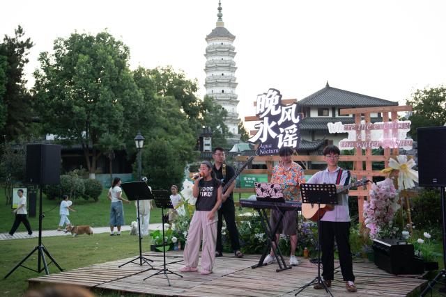 (260807) -- HEFEI, Aug. 7, 2026 (Xinhua) -- A folk performance is staged at Huiyuan Garden scenic area in Hefei, east China's Anhui Province, on July 31, 2026. Recently, the city of Hefei in east China has held a series of themed markets which took advantage of local cultural and tourism resources to boost consumption.
   At Huiyuan Garden scenic area, a cultural market featuring creative products, folk songs and performances, fish-shaped lantern parades and local delicacies offers visitors an immersive experience of Anhui culture.
   In Dawei Town, a grape-themed market provides a platform for local farmers to promote agricultural products. Visitors can taste various varieties of grapes and grape-based drinks, purchase agricultural products with discounts, and participate in study tours.
   By integrating cultural experiences, leisure activities and consumption, these themed markets have succeeded in attracting visitors while creating new opportunities for local tourism and rural industries. (Xinhua/Zhang Duan)