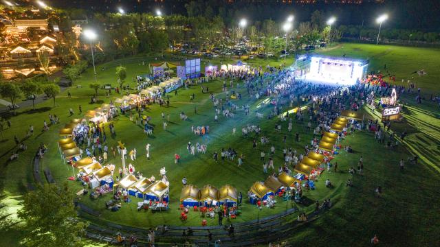 (260807) -- HEFEI, Aug. 7, 2026 (Xinhua) -- An aerial drone photo taken on July 31, 2026 shows a view of a grape-themed market in Dawei Town of Hefei, east China's Anhui Province. Recently, the city of Hefei in east China has held a series of themed markets which took advantage of local cultural and tourism resources to boost consumption.
   At Huiyuan Garden scenic area, a cultural market featuring creative products, folk songs and performances, fish-shaped lantern parades and local delicacies offers visitors an immersive experience of Anhui culture.
   In Dawei Town, a grape-themed market provides a platform for local farmers to promote agricultural products. Visitors can taste various varieties of grapes and grape-based drinks, purchase agricultural products with discounts, and participate in study tours.
   By integrating cultural experiences, leisure activities and consumption, these themed markets have succeeded in attracting visitors while creating new opportunities for local tourism and rural industries. (Photo by Ye Yuting/Xinhua)