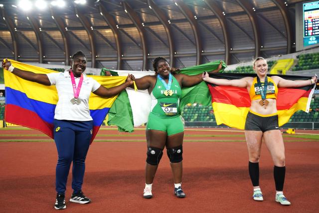 (260807) -- EUGENE, Aug. 7, 2026 (Xinhua) -- Gold medalist Jessica Oji (C) of Nigeria, silver medalist Belsy Jenniffer Quinonez (L) of Ecuador and bronze medalist Emily Scherf of Germany pose for photos after the women's shot put final at the 2026 World U20 Athletics Championships in Eugene, Oregon, the United States, Aug. 6, 2026. (Xinhua/Wu Xiaoling)