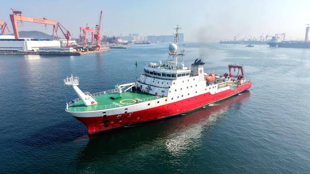 (260807) -- QINGDAO, Aug. 7, 2026 (Xinhua) -- A drone photo taken on Aug. 7, 2026 shows China's comprehensive research vessel KEXUE entering a wharf base in Qingdao, east China's Shandong Province. KEXUE docked at a wharf base of the Institute of Oceanology under the Chinese Academy of Sciences on Friday, marking the conclusion of a shared research cruise in the western Pacific after a 35-day voyage covering 5,845 nautical miles. The data and samples obtained during the cruise will provide scientific support for more accurate typhoon forecasting and global climate change research. (Photo by Yu Fangping/Xinhua)