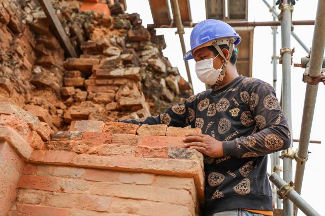 (260807) -- SIEM REAP, Aug. 7, 2026 (Xinhua) -- A staff member works at the restoration site of the Phnom Bakheng Temple's Brick Tower No. 13 in Siem Reap province, Cambodia, July 23, 2026.
  A team of conservation experts from the APSARA National Authority (ANA) is carrying out the second phase of restoration on Brick Tower No. 13 (G13) on the southern side of the Phnom Bakheng Temple in Cambodia's Angkor Archaeological Park. (ANA/Handout via Xinhua)