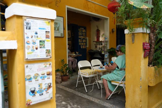 (260807) -- HANOI, Aug. 7, 2026 (Xinhua) -- People enjoy coffee at a coffee shop near Hoi An Ancient Town in Da Nang, Vietnam, on July 12, 2026. TO GO WITH "Feature: More than a drink: Coffee culture takes deeper root in Vietnamese life" (Xinhua/Liu Ying)