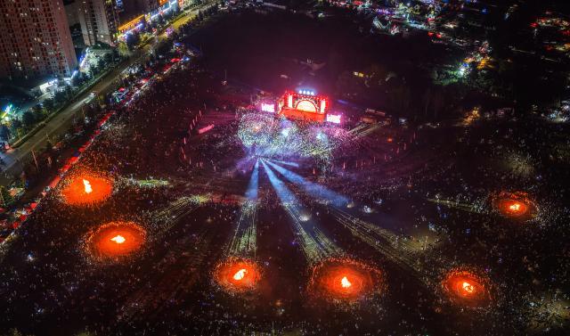 (260807) -- BEIJING, Aug. 7, 2026 (Xinhua) -- An aerial drone photo taken on Aug. 6, 2026 shows a scene of a torch festival revelry in Yi-Hui-Miao Autonomous County of Weining, Bijie, southwest China's Guizhou Province. The annual torch festivals were held in multiple locations on Thursday night, attracting crowds of tourists and locals from different ethnic groups. (Xinhua/Tao Liang)