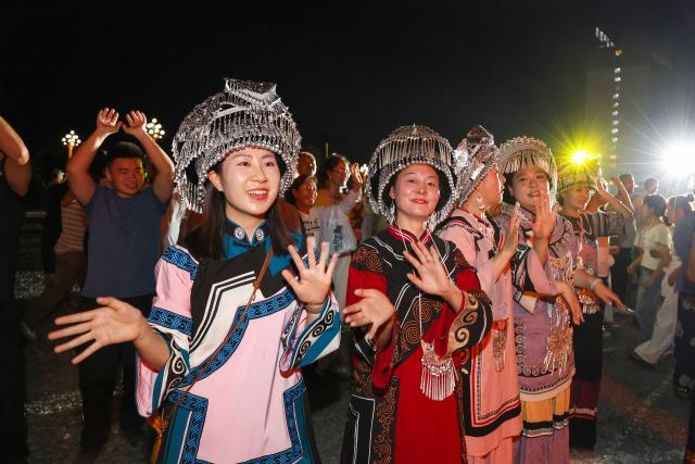 (260807) -- BEIJING, Aug. 7, 2026 (Xinhua) -- People celebrate the torch festival in Bijie, southwest China's Guizhou Province, Aug. 6, 2026. The annual torch festivals were held in multiple locations on Thursday night, attracting crowds of tourists and locals from different ethnic groups. (Photo by Li Hua/Xinhua)