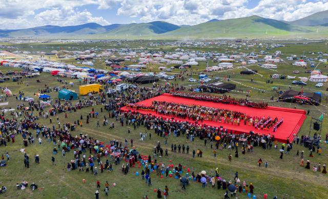 (260807) -- GARZE, Aug. 7, 2026 (Xinhua) -- An aerial drone photo taken on Aug. 7, 2026 shows a scene of the tent festival in Shiqu County of Garze Tibetan Autonomous Prefecture, southwest China's Sichuan Province. A tent festival kicked off here on Friday. During the festival, local residents and tourists gather together, setting up tents and enjoying activities including horse racing, singing and dancing performances, and traditional sports competitions. (Xinhua/Jiang Hongjing)