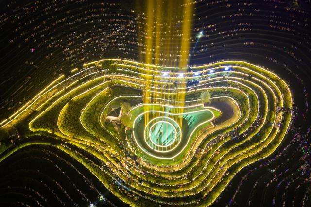 (260807) -- BIJIE, Aug. 7, 2026 (Xinhua) -- An aerial drone photo taken on Aug. 7, 2026 shows a concert held on the terraced field in Shexiang ancient town of Dafang County in Bijie, southwest China's Guizhou Province. (Photo by Luo Dafu/Xinhua)