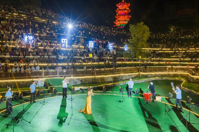 (260807) -- BIJIE, Aug. 7, 2026 (Xinhua) -- A drone photo taken on Aug. 7, 2026 shows a concert held on the terraced field in Shexiang ancient town of Dafang County in Bijie, southwest China's Guizhou Province. (Photo by Luo Dafu/Xinhua)