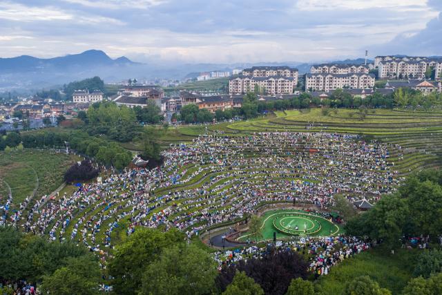 (260807) -- BIJIE, Aug. 7, 2026 (Xinhua) -- An aerial drone photo taken on Aug. 7, 2026 shows a concert held on the terraced field in Shexiang ancient town of Dafang County in Bijie, southwest China's Guizhou Province. (Photo by Luo Dafu/Xinhua)