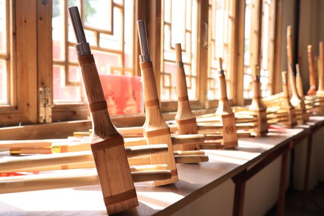 (260807) -- GUIYANG, Aug. 7, 2026 (Xinhua) -- This photo taken on July 11, 2026 shows Lusheng, an ancient instrument of six bamboo pipes, at a workshop in Gaopo Township of Guiyang, southwest China's Guizhou Province. TO GO WITH "Across China: Centuries-old ethnic musical instrument finds new guardians in rural southwest China" (Xinhua)