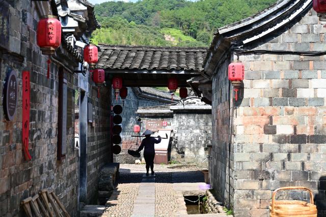 (260808) -- LONGYAN, Aug. 8, 2026 (Xinhua) -- This photo taken on Aug. 5, 2026 shows a view of Peitian Village in Xuanhe Town, Liancheng County, Longyan City, southeast China's Fujian Province. Boasting a history of more than 800 years, Peitian Village is home to a complex of buildings from the Ming (1368-1644) and Qing (1644-1911) dynasties, as well as over 20 key cultural relic sites under state-level protection. It was listed as one of China's historic and cultural villages in 2005 and inscribed in the first batch of traditional Chinese villages catalog in 2012. Local authorities have injected new vitality into the village through efforts of integrated cultural and tourism development. (Xinhua/Lin Shanchuan)