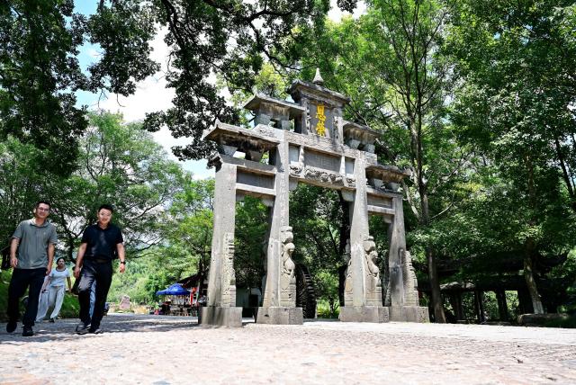 (260808) -- LONGYAN, Aug. 8, 2026 (Xinhua) -- This photo taken on Aug. 5, 2026 shows an archway at Peitian Village, Xuanhe Town, Liancheng County, Longyan City, southeast China's Fujian Province. Boasting a history of more than 800 years, Peitian Village is home to a complex of buildings from the Ming (1368-1644) and Qing (1644-1911) dynasties, as well as over 20 key cultural relic sites under state-level protection. It was listed as one of China's historic and cultural villages in 2005 and inscribed in the first batch of traditional Chinese villages catalog in 2012. Local authorities have injected new vitality into the village through efforts of integrated cultural and tourism development. (Xinhua/Lin Shanchuan)