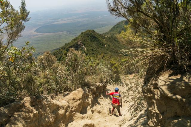 (260808) -- NAKURU, Aug. 8, 2026 (Xinhua) -- A tourist hikes around the volcanic crater at Mount Longonot National Park in Nakuru, Kenya, Aug. 8, 2026. Mount Longonot National Park is located in Nakuru County in central Kenya, in the Great Rift Valley. Established in 1983, the park covers an area of about 52 square kilometers. Centered around the dormant Mount Longonot volcano, the park features a hiking trail around the volcanic crater and is a renowned destination in Kenya for its volcanic landscape and hiking. (Xinhua/Xie Jianfei)