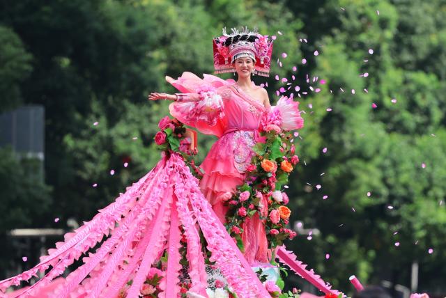 (260809) -- BEIJING, Aug. 9, 2026 (Xinhua) -- A woman performs during a parade marking the 70th anniversary of the founding of the Bouyei-Miao Autonomous Prefecture of Qiannan in Duyun City, the Bouyei-Miao Autonomous Prefecture of Qiannan, southwest China's Guizhou Province, Aug. 8, 2026. The Bouyei-Miao Autonomous Prefecture of Qiannan, established on Aug. 8, 1956, is home to more than 4.2 million people from the Bouyei, Miao, Shui, Han, Yao, Maonan and other ethnic groups. (Xinhua/Liu Xu)