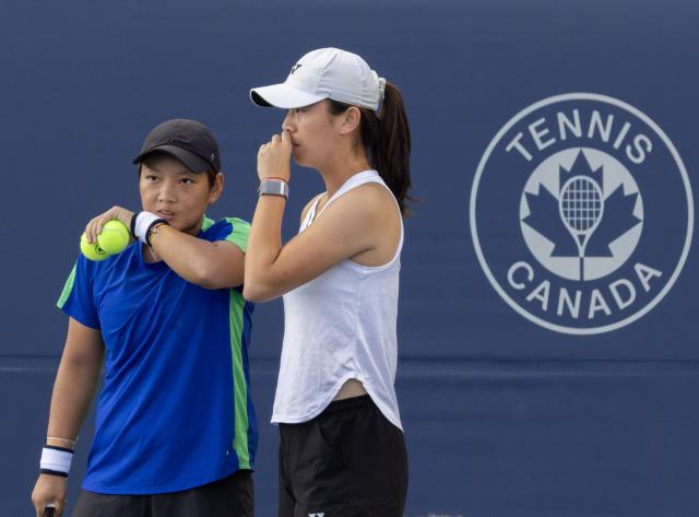 (260809) -- TORONTO, Aug. 9, 2026 (Xinhua) -- Jiang Xinyu (L)/Wu Fang-Hsien talk to each other during the second round of the women's doubles match between Jiang Xinyu (China)/Wu Fang-Hsien (Chinese Taipei) and Elise Mertens (Belgium)/Diana Shnaider (Russia) at the 2026 National Bank Open tennis tournament in Toronto, Canada, Aug. 8, 2026. (Photo by Zou Zheng/Xinhua)
