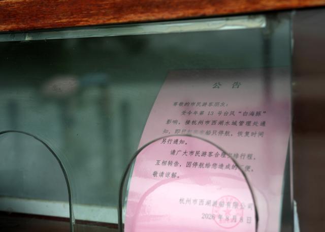 (260809) -- HANGZHOU, Aug. 9, 2026 (Xinhua) -- A notice on the suspension of sightseeing boats is seen at the West Lake scenic spot in Hangzhou, east China's Zhejiang Province, Aug. 9, 2026. China's national observatory on Sunday activated a red alert -- the highest level in the country's typhoon warning system -- as Typhoon Dolphin approaches.
  Typhoon Dolphin is forecast to make landfall along the country's east coast from Zhoushan in Zhejiang Province to Fuding in Fujian Province, according to the National Meteorological Center (NMC). (Xinhua/Han Chuanhao)