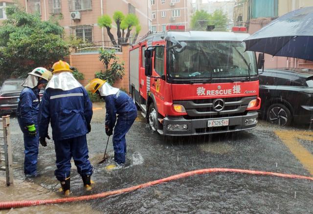 (260809) -- SHANGHAI, Aug. 9, 2026 (Xinhua) -- Firefighters drain water at a residential area in Changning District of Shanghai, east China, Aug. 9, 2026. Shanghai experienced strong winds and rainfalls on Sunday as Typhoon Dolphin approached, with the typhoon's impact expected to last until Aug. 11.
  China's national observatory on Sunday activated a red alert -- the highest level in the country's typhoon warning system -- as Typhoon Dolphin approaches.
  Typhoon Dolphin is forecast to make landfall along the country's east coast from Zhoushan in Zhejiang Province to Fuding in Fujian Province, according to the National Meteorological Center (NMC). (Photo by Yan Jianmeng/Xinhua)
