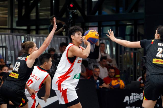 (260809) -- BUCHAREST, Aug. 9, 2026 (Xinhua) -- China's Yang Hengyu (C) prepares to shoot during the Pool D match between China and Belgium at the FIBA 3X3 Women's Series CS Rapid Stop 2026 at Parklake mall in Bucharest, Romania, Aug. 8, 2026. (Photo by Cristian Cristel/Xinhua)