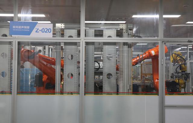 (260809) -- NINGXIANG, Aug. 9, 2026 (Xinhua) -- Robots work at a factory of the Changsha FinDreams Battery Co., Ltd. in Ningxiang City, central China's Hunan Province, July 5, 2026. Ningxiang City has focused on developing the advanced energy storage materials industry and has built a complete industrial chain covering energy storage materials, battery cell manufacturing and used battery recycling. From January to May this year, the city had 43 major enterprises in the energy storage materials sector, with the industry's output value exceeding 26 billion yuan (about 3.6 billion U.S. dollars). (Xinhua/Lu Peng)