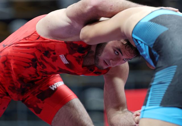 (260809) -- XI'AN, Aug. 9, 2026 (Xinhua) -- Sherzod Poyonov (L) of Uzbekistan and Habila Awusayiman of China compete during the men's freestyle 97kg final at 2026 China-Central Asia Elite Wrestling Tournament in Xi'an, northwest China's Shaanxi Province, Aug. 9, 2026. (Xinhua/Li Yibo)