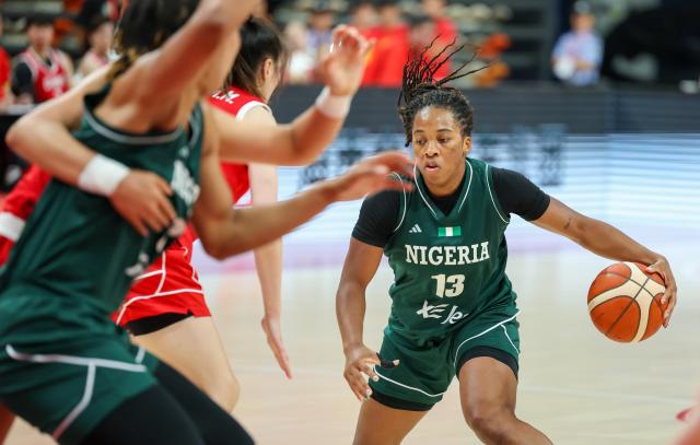 (260809) -- HAIKOU, Aug. 9, 2026 (Xinhua) -- Gabrielle White (R) of Nigeria competes during a friendly basketball match between China and Nigeria in Haikou, south China's Hainan Province, Aug. 9, 2026. (Xinhua/Yang Guanyu)