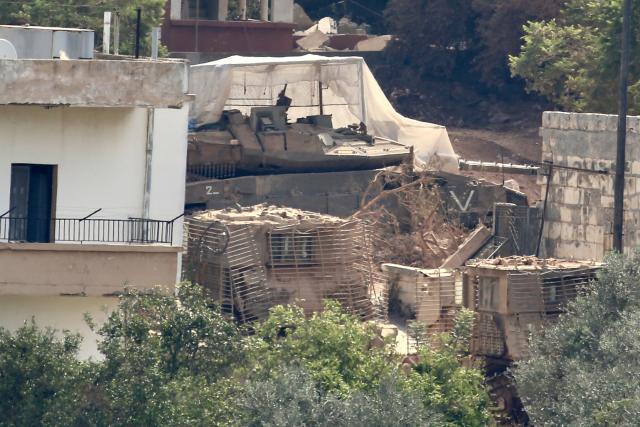 (260809) -- ZAWTAR AL-GHARBIYAH, Aug. 9, 2026 (Xinhua) -- An Israeli tank is seen stationed in Zawtar al-Gharbiyah following an Israeli advance into Zawtar al-Gharbiyah, southern Lebanon, Aug. 8, 2026. (Photo by Ali Hashisho/Xinhua)