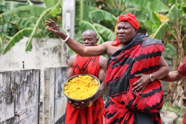 (260809) -- ACCRA, Aug. 9, 2026 (Xinhua) -- People sprinkle traditional food "kpekple" to celebrate Homowo festival in Accra, Ghana, Aug. 8, 2026. People of Ghana's Ga ethnic group celebrated the annual Homowo festival in the capital Accra on Saturday, showcasing a vibrant blend of traditional rituals, music, costumes, and communal festivities. (Photo by Seth/Xinhua)