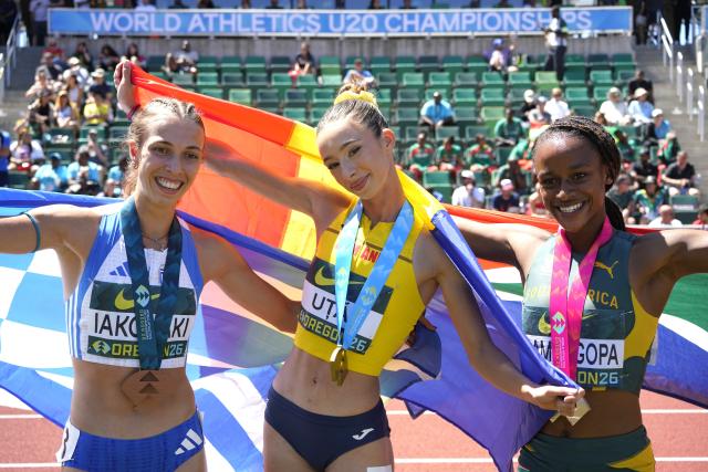 (260810) -- EUGENE, Aug. 10, 2026 (Xinhua) -- Gold medalist Alexandra Stefania Uta (C) of Romania ccelebrates with silver medalist Tumi Ramokgopa (R) of South Africa and bronze medalist Eleni Iakovaki of Greece after the women 400m hurdles final at the 2026 World U20 Athletics Championships in Eugene, Oregon, the United States, Aug. 9, 2026. (Xinhua/Wu Xiaoling)