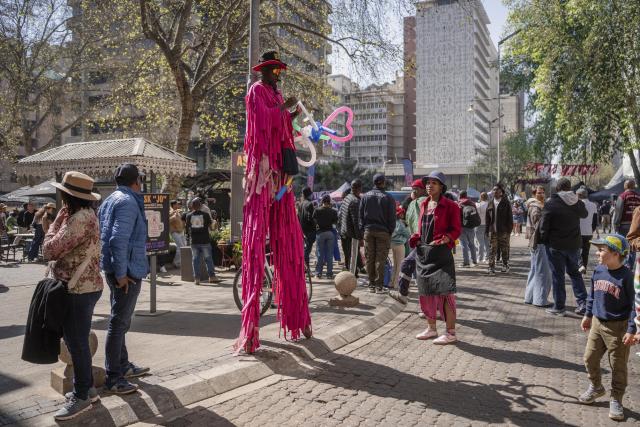 (260810) -- JOHANNESBURG, Aug. 10, 2026 (Xinhua) -- People take part in activities on a street during a car-free event in Johannesburg, South Africa, Aug. 9, 2026. During the event, some streets in Johannesburg were turned into car-free zones from 10 a.m. to 5 p.m., with motor vehicles banned. (Photo by Ihsaan Haffejee/Xinhua)