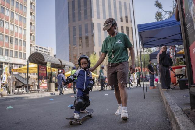 (260810) -- JOHANNESBURG, Aug. 10, 2026 (Xinhua) -- A kid skateboards on a street during a car-free event in Johannesburg, South Africa, Aug. 9, 2026. During the event, some streets in Johannesburg were turned into car-free zones from 10 a.m. to 5 p.m., with motor vehicles banned. (Photo by Ihsaan Haffejee/Xinhua)