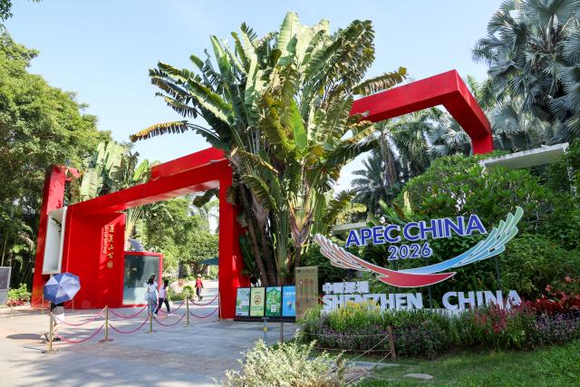 (260810) -- SHENZHEN, Aug. 10, 2026 (Xinhua) -- A themed installation is pictured at Lianhuashan Park in Shenzhen, south China's Guangdong Province, Aug. 10, 2026. With themed bulletin boards, outdoor posts, decorations and installations, Shenzhen marked on Monday the 100-day countdown to the 33rd Asia-Pacific Economic Cooperation (APEC) Economic Leaders' Meeting. (Xinhua/Liang Xu)