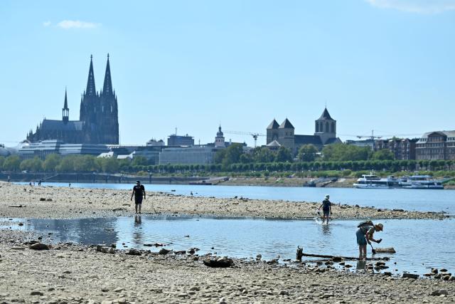 (260810) -- COLOGNE, Aug. 10, 2026 (Xinhua) -- People enjoy themselves on the banks of the Rhine River in Cologne, Germany, Aug. 10, 2026. Persistent drought has caused water levels to fall along several sections of the Rhine River in Germany. (Photo by Ulrich Hufnagel/Xinhua)