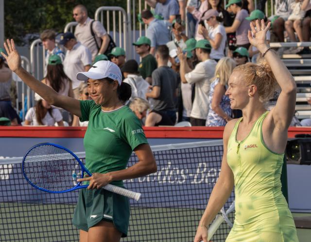 (260811) -- TORONTO, Aug. 11, 2026 (Xinhua) -- Katerina Siniakova/Zhang Shuai (L) celebrate victory after the women's doubles quarterfinal match between Katerina Siniakova (the Czech Republic)/Zhang Shuai (China) and Storm Hunter (Australia)/Desirae Krawczyk (the United States) at the 2026 National Bank Open tennis tournament in Toronto, Canada, Aug. 10, 2026. (Photo by Zou Zheng/Xinhua)