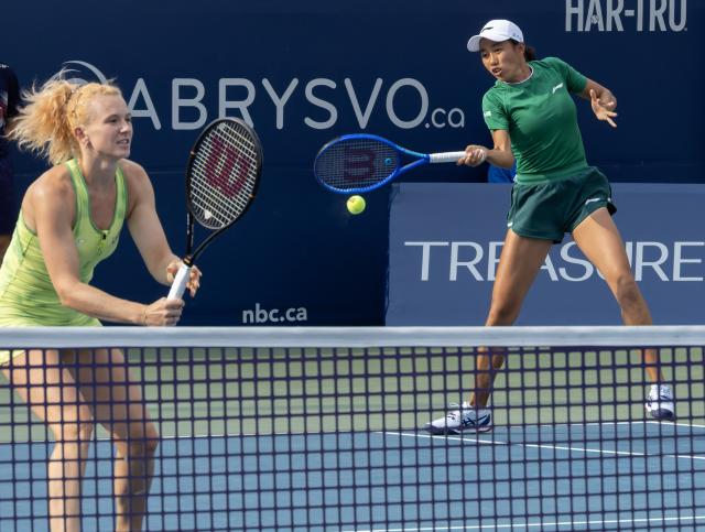 (260811) -- TORONTO, Aug. 11, 2026 (Xinhua) -- Katerina Siniakova/Zhang Shuai (R) compete during the women's doubles quarterfinal match between Katerina Siniakova (the Czech Republic)/Zhang Shuai (China) and Storm Hunter (Australia)/Desirae Krawczyk (the United States) at the 2026 National Bank Open tennis tournament in Toronto, Canada, Aug. 10, 2026. (Photo by Zou Zheng/Xinhua)