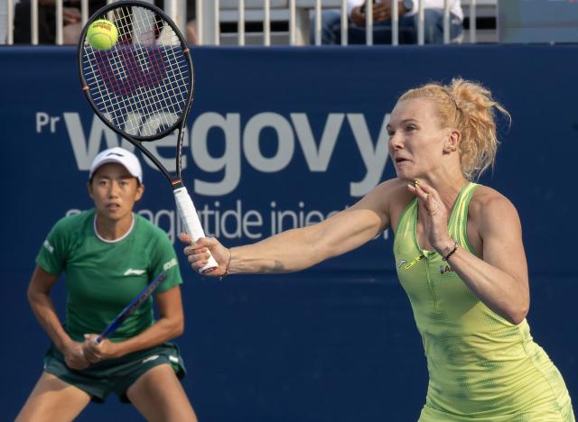 (260811) -- TORONTO, Aug. 11, 2026 (Xinhua) -- Katerina Siniakova (R)/Zhang Shuai compete during the women's doubles quarterfinal match between Katerina Siniakova (the Czech Republic)/Zhang Shuai (China) and Storm Hunter (Australia)/Desirae Krawczyk (the United States) at the 2026 National Bank Open tennis tournament in Toronto, Canada, Aug. 10, 2026. (Photo by Zou Zheng/Xinhua)