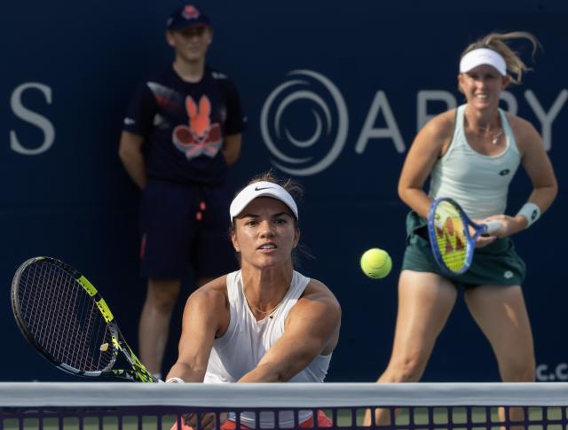 (260811) -- TORONTO, Aug. 11, 2026 (Xinhua) -- Storm Hunter/Desirae Krawczyk (front) compete during the women's doubles quarterfinal match between Katerina Siniakova (the Czech Republic)/Zhang Shuai (China) and Storm Hunter (Australia)/Desirae Krawczyk (the United States) at the 2026 National Bank Open tennis tournament in Toronto, Canada, Aug. 10, 2026. (Photo by Zou Zheng/Xinhua)