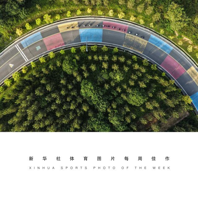 (260811) -- BEIJING, Aug. 11, 2026 (Xinhua) -- XINHUA SPORTS PHOTO OF THE WEEK (from Aug. 3 to Aug. 9, 2026) TRANSMITTED on Aug. 11, 2026. A drone photo taken on Aug. 8, 2026 shows cyclists ride in a town in Jiyuan, east China's Shandong Province, on China's 18th National Fitness Day. (Photo by Miao Qiunao/Xinhua)