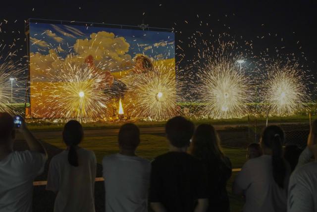 (260811) -- ZUNHUA, Aug. 11, 2026 (Xinhua) -- Tourists watch a molten iron fireworks show at a paddy-field scenic area in Shanligezhuang Village of Zunhua, north China's Hebei Province, Aug. 10, 2026. (Photo by Liu Mancang/Xinhua)