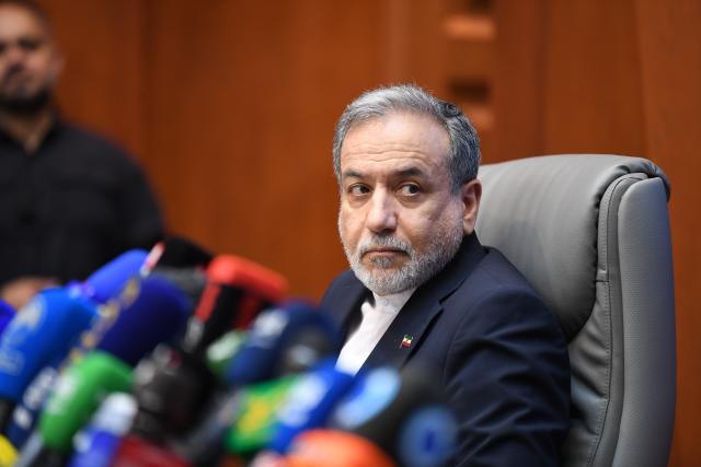 (260811) -- TEHRAN, Aug. 11, 2026 (Xinhua) -- Iran's Foreign Minister Seyed Abbas Araghchi attends a ceremony where Iran's Foreign Ministry and Health Ministry sign a memorandum of understanding (MoU) on cooperation in rebuilding infrastructure damaged during the war in Tehran, Iran, Aug. 11, 2026. Araghchi said on Tuesday that meeting the country's healthcare needs was among the most challenging tasks undertaken by his ministry during the 40-day war with the United States and Israel. (Xinhua/Shadati)