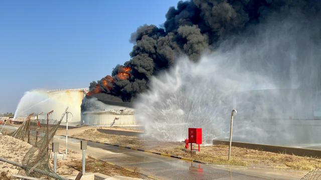 (260811) -- TRIPOLI, Aug. 11, 2026 (Xinhua) -- This photo taken with a mobile phone shows a fuel tank still burning at the Zawiya oil refinery in Zawiya, western Libya, Aug. 11, 2026. Libya's National Oil Corporation (NOC) on Monday night said in a statement that a fuel tank at the Zawiya oil refinery was directly targeted, causing a severe fire and the complete collapse of the tank. (Str/Xinhua)