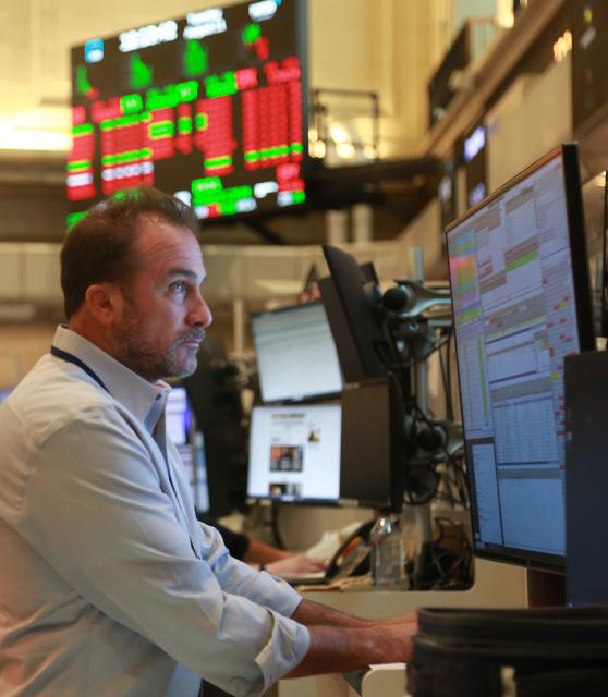 (260811) -- NEW YORK, Aug. 11, 2026 (Xinhua) -- A trader works on the trading floor of the New York Stock Exchange in New York, the United States, on Aug. 11, 2026. U.S. stocks ended lower on Tuesday. (Xinhua/Liu Yanan)