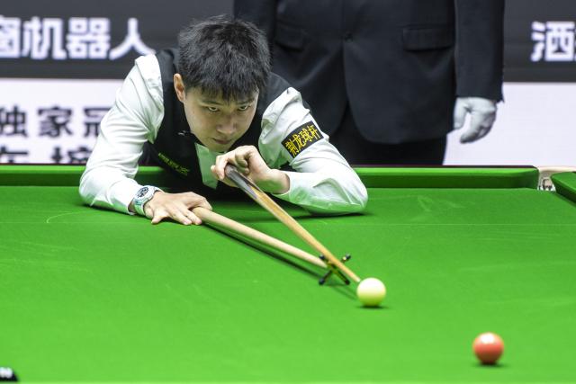 (260812) -- TAIYUAN, Aug. 12, 2026 (Xinhua) -- Zhao Xintong of China competes during the round 1 match between Zhao Xintong of China and Zhang Anda of China at China Open 2026 snooker tournament in Taiyuan, north China's Shanxi Province, Aug. 11, 2026. (Xinhua/Cao Yang)