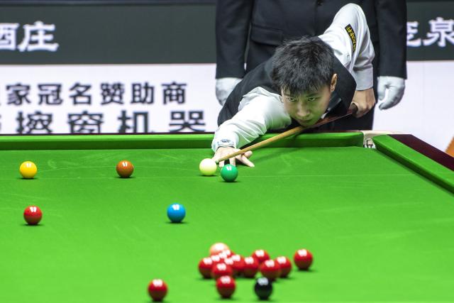 (260812) -- TAIYUAN, Aug. 12, 2026 (Xinhua) -- Zhao Xintong of China competes during the round 1 match between Zhao Xintong of China and Zhang Anda of China at China Open 2026 snooker tournament in Taiyuan, north China's Shanxi Province, Aug. 11, 2026. (Xinhua/Cao Yang)